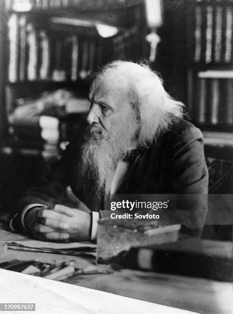 Dimitri ivanovich mendeleev, 1834 - 1907, the famous russian chemist in his study.