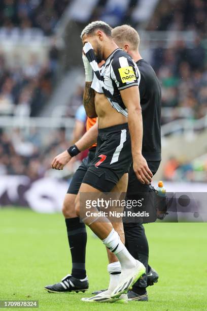 Joelinton of Newcastle United leaves the pitch after an injury during the Premier League match between Newcastle United and Burnley FC at St. James...
