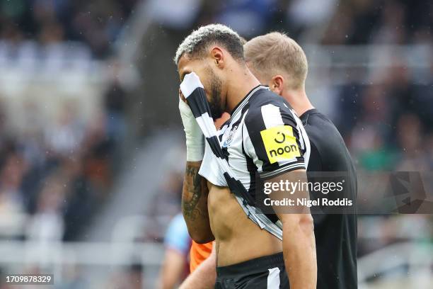 Joelinton of Newcastle United leaves the pitch after an injury during the Premier League match between Newcastle United and Burnley FC at St. James...