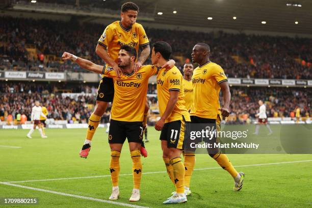 Hwang Hee-Chan of Wolverhampton Wanderers celebrates with teammates after scoring the team's second goal during the Premier League match between...