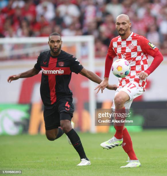 Anthony Caci of 1.FSV Mainz 05 is challenged by Jonathan Tah of Bayer Leverkusen during the Bundesliga match between 1. FSV Mainz 05 and Bayer 04...
