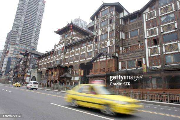 An renovated old building located along a main street of the 3,000-year-old Chongqing city, built on top of steep hills squeezed onto a narrow strip...