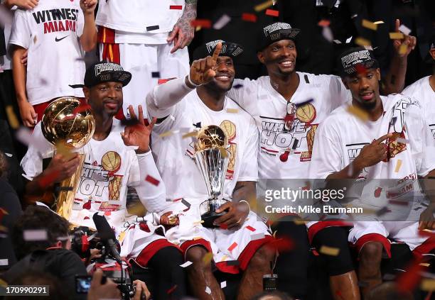 Dwyane Wade, LeBron James, Chris Bosh and Norris Cole of the Miami Heat celebrate after defeating the San Antonio Spurs 95-88 to win Game Seven of...
