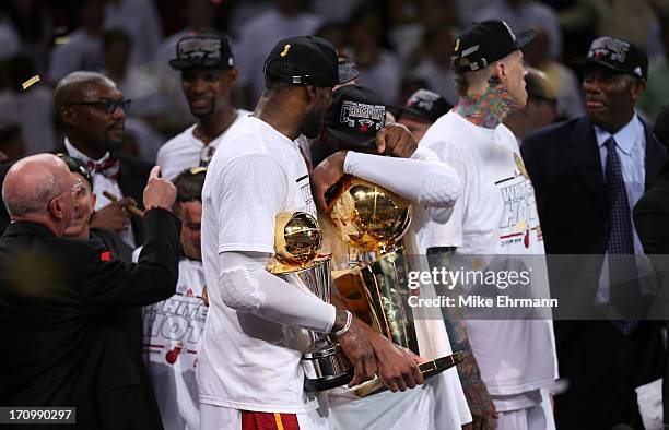 LeBron James and Dwyane Wade of the Miami Heat celebrate after defeating the San Antonio Spurs 95-88 to win Game Seven of the 2013 NBA Finals at...