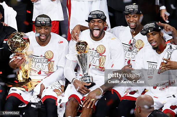 Dwyane Wade, LeBron James, Chris Bosh and Norris Cole of the Miami Heat celebrate after defeating the San Antonio Spurs 95-88 to win Game Seven of...