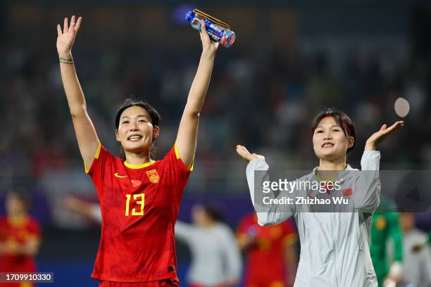 Yang Lina and Dou Jiaxing of China thank the fans after the 19th Asian Games Women's Quarterfinal match between China and Thailand at Linping Sports...