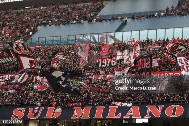 Fans of AC Milan enjoy the pre-match atmosphere prior to the Serie A TIM match between AC Milan and SS Lazio at Stadio Giuseppe Meazza on September...