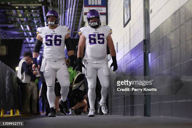 September 19: Garrett Bradbury and Austin Schlottmann of the Minnesota Vikings walk down the tunnel prior to a game between against the Philadelphia...