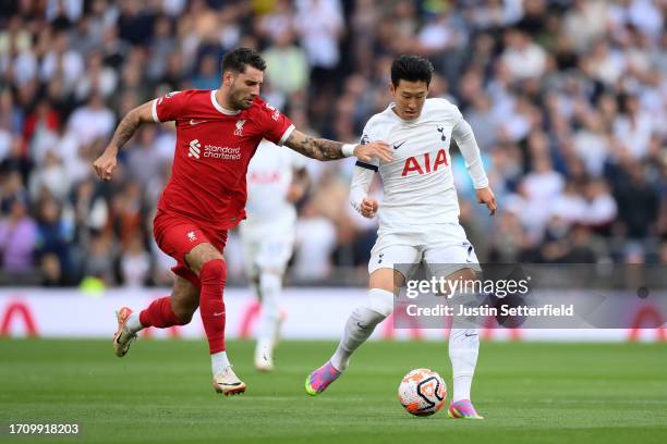 Dominik Szoboszlai of Liverpool battles for possession with Heung-Min Son of Tottenham Hotspur during the Premier League match between Tottenham...