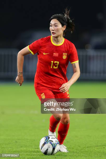 Yang Lina of China controls the ball during the 19th Asian Games Women's Quarterfinal match between China and Thailand at Linping Sports Centre...