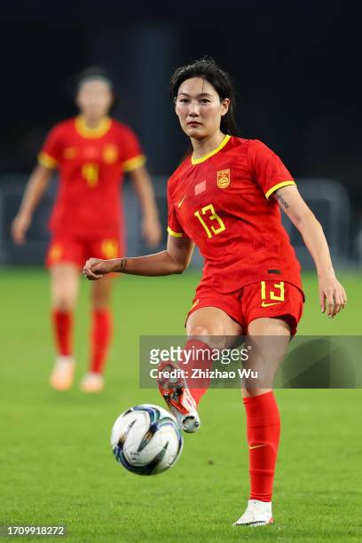 Yang Lina of China pass the ball during the 19th Asian Games Women's Quarterfinal match between China and Thailand at Linping Sports Centre Stadium...