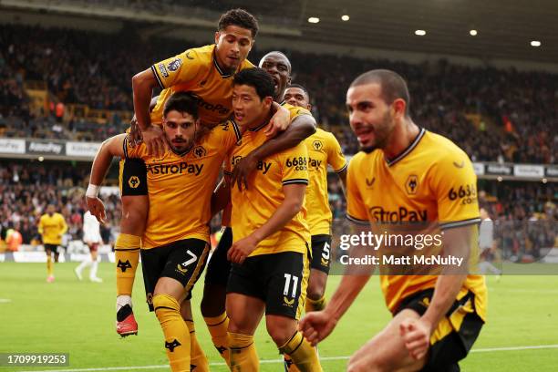 Hwang Hee-Chan of Wolverhampton Wanderers celebrates with teammates after scoring the team's second goal during the Premier League match between...