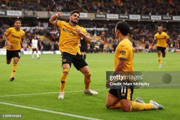 Hwang Hee-Chan of Wolverhampton Wanderers celebrates with teammate Pedro Neto after scoring the team's second goal during the Premier League match...