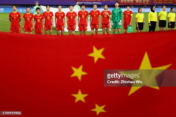 Players of China line up for the national anthem during the 19th Asian Games Women's Quarterfinal match between China and Thailand at Linping Sports...