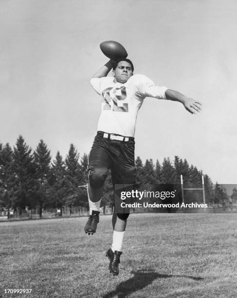 Star Hawaiian quarterback and tailback Joe Francis at Oregon State University. He went on to play backup to Bart Starr for the Green Bay Packers,...