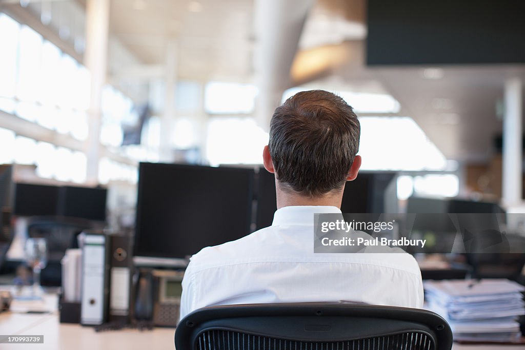Businessman working at desk in office