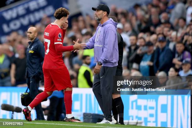 Curtis Jones of Liverpool leaves the pitch after being shown a red card during the Premier League match between Tottenham Hotspur and Liverpool FC at...