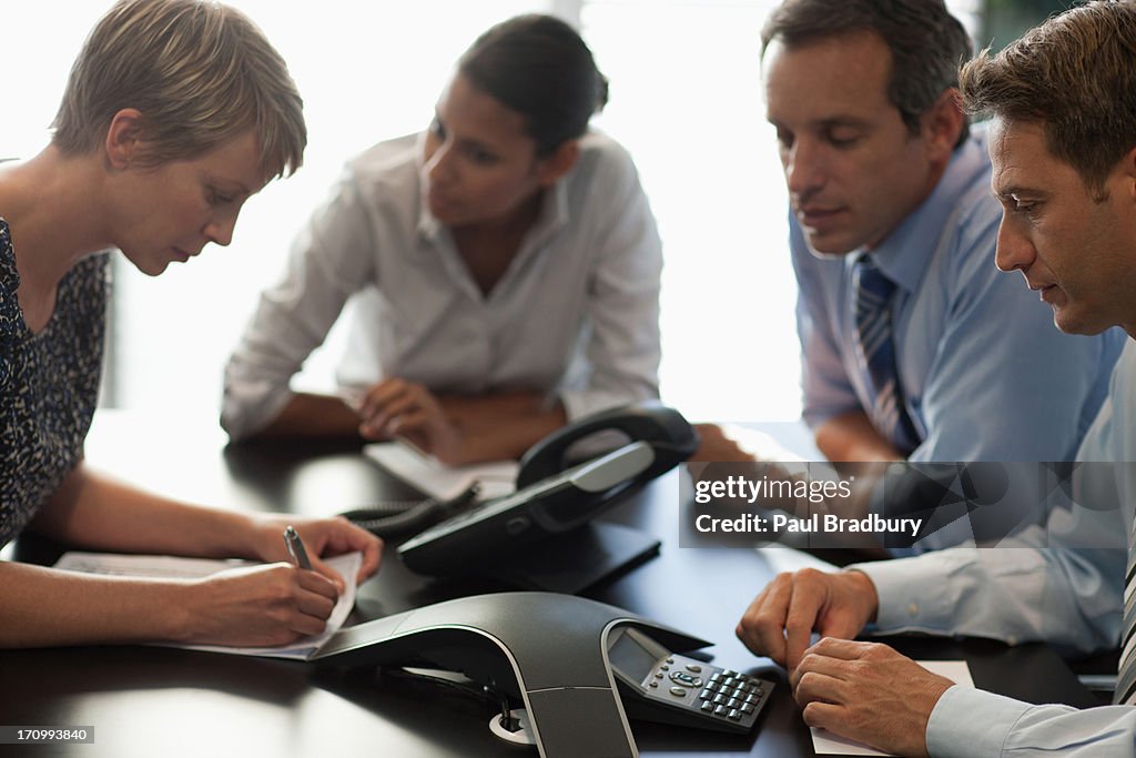 Business people talking on conference call