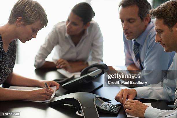 business people talking on conference call - conference phone stock pictures, royalty-free photos & images