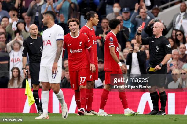 Referee, Simon Hooper shows a red card to Curtis Jones of Liverpool during the Premier League match between Tottenham Hotspur and Liverpool FC at...