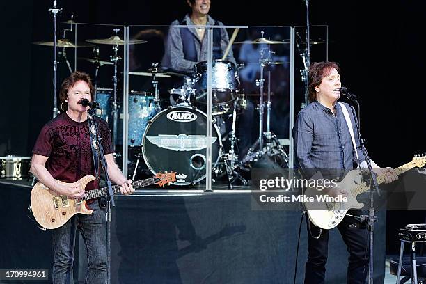 Tom Johnston and John McFee of The Doobie Brothers perform on stage at The Greek Theatre on June 20, 2013 in Los Angeles, California.