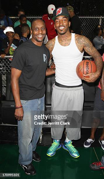 Former NBA Player Dee Brown poses with NBA player J.R. Smith at the Reebok Classic Pump Omni Lite Dunk Contest at EBC at Rucker Park on June 20, 2013...