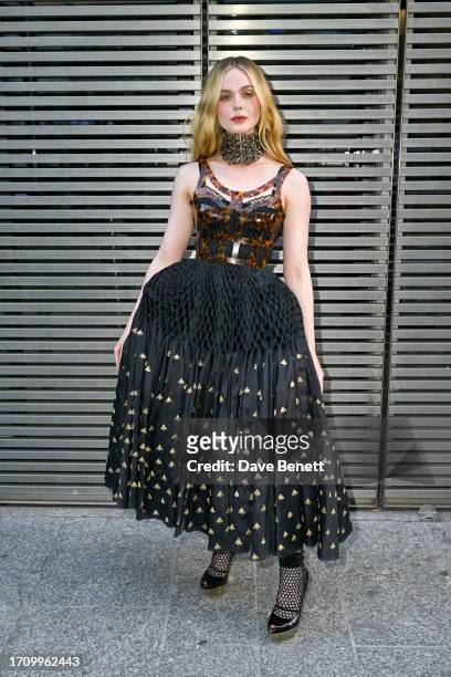 Elle Fanning attends the Alexander McQueen SS24 show during Paris Fashion Week at Le Carreau du Temple on September 30, 2023 in Paris, France.