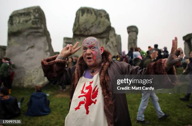Solstice reveller Mad Al gestures as he joins druids, pagans and revellers celebrating the summer solstice at the megalithic monument of Stonehenge...