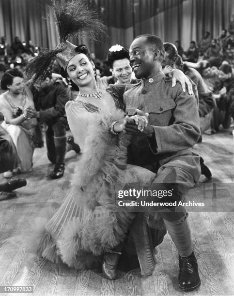 Singer, dancer and actress Lena Horne with Bill 'Bojangles' Robinson in the musical film 'Stormy Weather,' Hollywood, California, 1943.