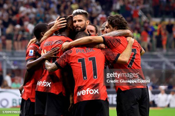Olivier Giroud of AC Milan celebrates after his team-mate Christian Pulisic scored during the Serie A TIM match between AC Milan and SS Lazio at...