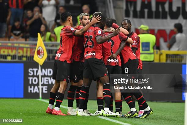 Christian Pulisic of AC Milan celebrates with teammates after scoring his team's first goal during the Serie A TIM match between AC Milan and SS...