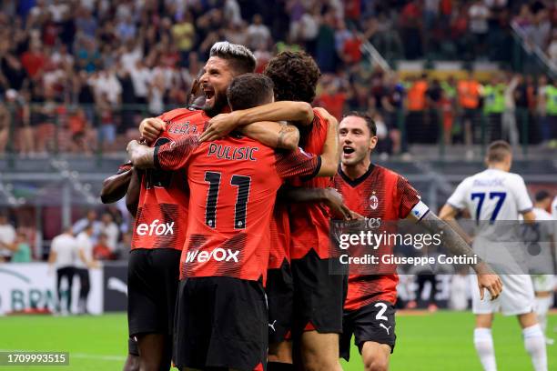 Olivier Giroud of AC Milan celebrates with his team-mates after Christian Pulisic scored during the Serie A TIM match between AC Milan and SS Lazio...