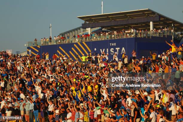 Fans show their support on the 16th green during the Saturday afternoon fourball matches of the 2023 Ryder Cup at Marco Simone Golf Club on September...