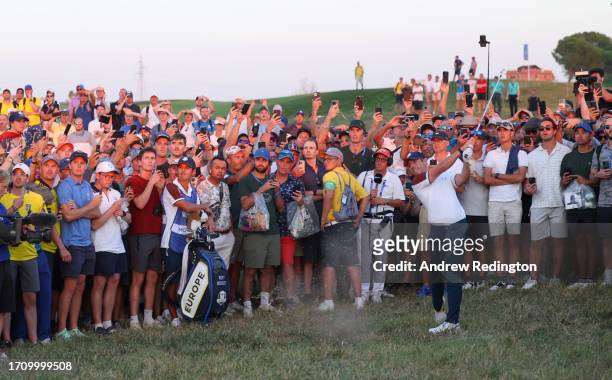Rory McIlroy of Team Europe plays his second shot on the 18th hole during the Saturday afternoon fourball matches of the 2023 Ryder Cup at Marco...