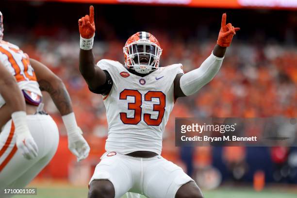Ruke Orhorhoro of the Clemson Tigers celebrates after a sack during the first quarter against the Syracuse Orange at JMA Wireless Dome on September...