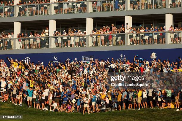 Fans wave their hats on the 16th hole during the Saturday afternoon fourball matches of the 2023 Ryder Cup at Marco Simone Golf Club on September 30,...