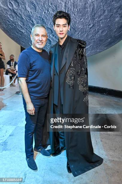 Elie Saab and Jun Gong pose backstage prior to the Elie Saab Womenswear Spring/Summer 2024 show as part of Paris Fashion Week on September 30, 2023...