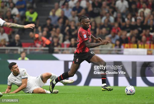 Rafael Leao of AC Milan runs with the ball during the Serie A TIM match between AC Milan and SS Lazio at Stadio Giuseppe Meazza on September 30, 2023...