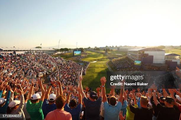 General view as the fans partake in a thunderclap on the 1st tee during the Saturday morning foursomes matches of the 2023 Ryder Cup at Marco Simone...