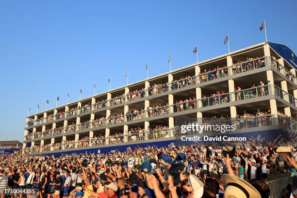 Spectators wave their hats to Patrick Cantlay during the Saturday afternoon fourball matches of the 2023 Ryder Cup at Marco Simone Golf Club on...