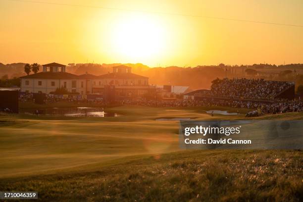 General view of the green on teh par five 18th hole as the sun sets during the Saturday afternoon four-ball matches of the 2023 Ryder Cup at Marco...