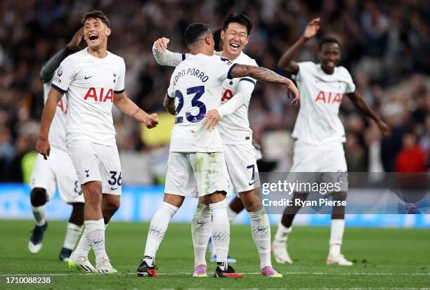 Heung-Min Son of Tottenham Hotspur celebrates with teammate Pedro Porro following the team's victory during the Premier League match between...