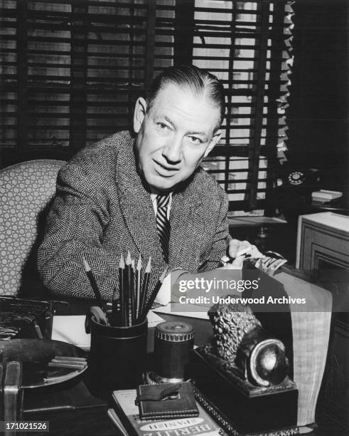 Poet Ogden Nash at work at his desk, 1952.