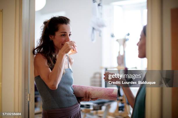 drinking cups of tea in the gym - indulgence stock pictures, royalty-free photos & images