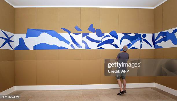 Visitor looks at the art work "La piscine" inspired by French artist Henri Matisse at the Matisse Museum on June 20, 2013 in Nice, southeastern...