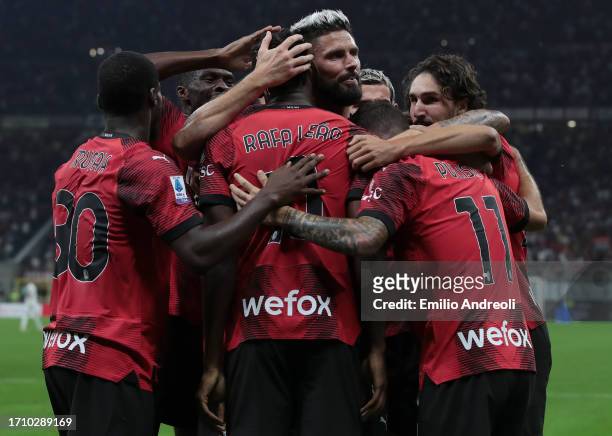 Christian Pulisic of AC Milan celebrates with teammates after scoring the team's first goal during the Serie A TIM match between AC Milan and SS...