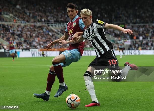 Hjalmar Ekdal of Burnley vies with Anthony Gordon of Newcastle United during the Premier League match between Newcastle United and Burnley FC at St....