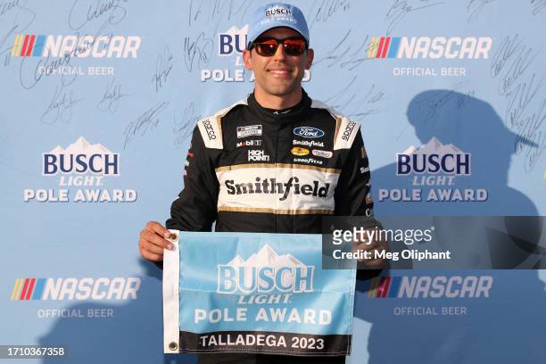 Aric Almirola, driver of the Smithfield Ford, poses for photos after winning the pole award during qualifying for the NASCAR Cup Series YellaWood 500...