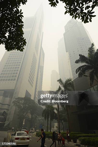 The Overseas Union Bank Centre building, left, and the United Overseas Bank Plaza Two building, right, stand shrouded in smog in Singapore, on...