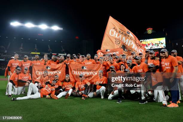 Members of the Baltimore Orioles pose for a team photo on the field after defeating the Boston Red Sox to win the American League East at Oriole Park...